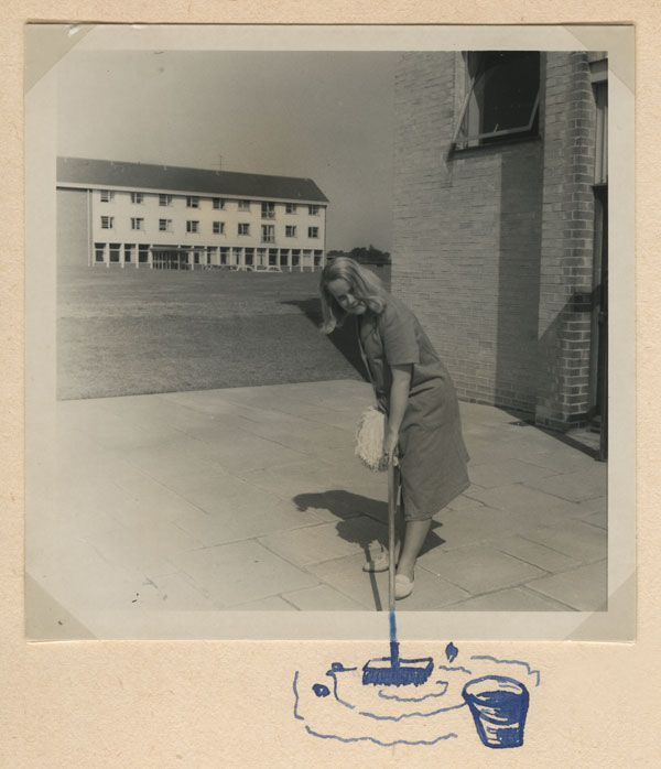 Katharina with her mop and bucket. From her photo album.